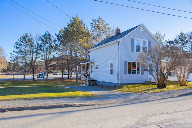 view of home's exterior featuring a yard