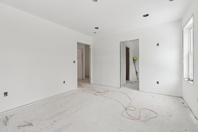 interior space featuring multiple windows and ensuite bath