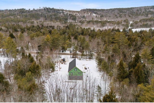 drone / aerial view featuring a wooded view