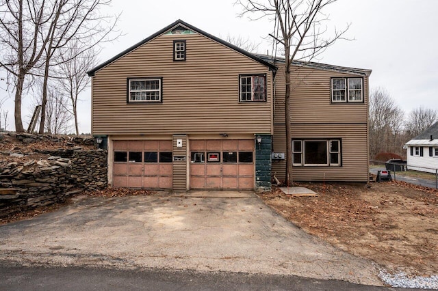 view of property exterior with a garage