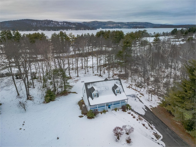 snowy aerial view with a mountain view