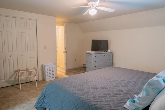 carpeted bedroom featuring a closet, vaulted ceiling, ceiling fan, and a baseboard heating unit