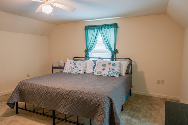 bedroom with ceiling fan, lofted ceiling, and light carpet