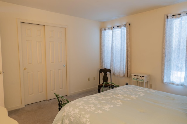 bedroom with a closet and carpet floors