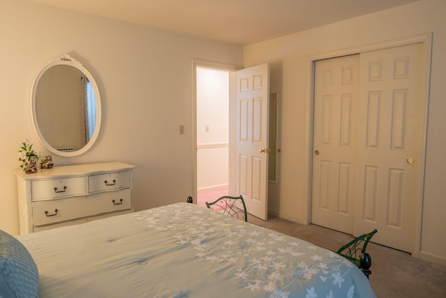 bedroom with light colored carpet and a closet