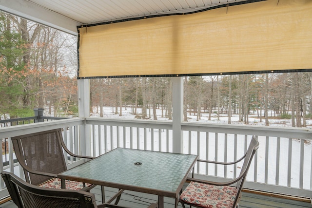 sunroom with plenty of natural light and wooden ceiling