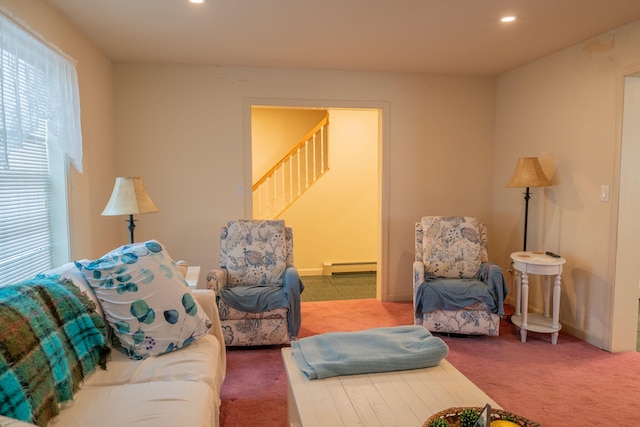 living room with carpet and baseboard heating