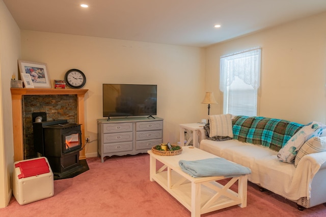 carpeted living room featuring a wood stove