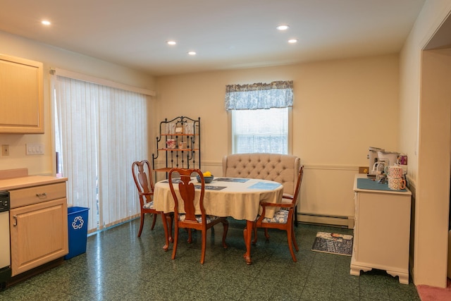 dining area with a baseboard heating unit