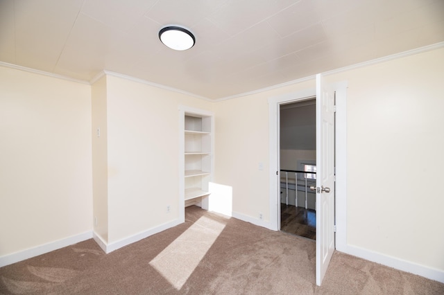 unfurnished bedroom featuring carpet flooring and ornamental molding