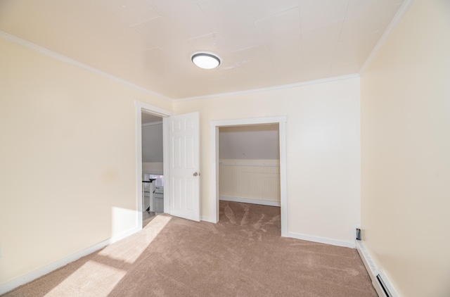 carpeted empty room featuring a baseboard radiator and ornamental molding