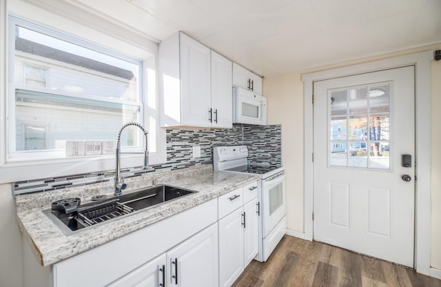 kitchen featuring white cabinets, white appliances, sink, and dark wood-type flooring