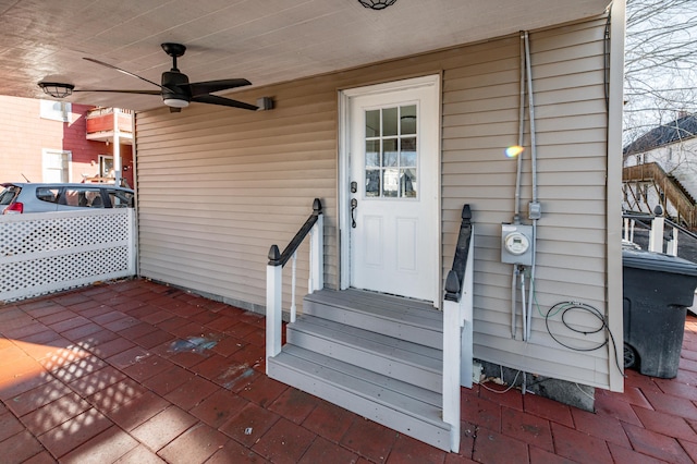 doorway to property featuring ceiling fan