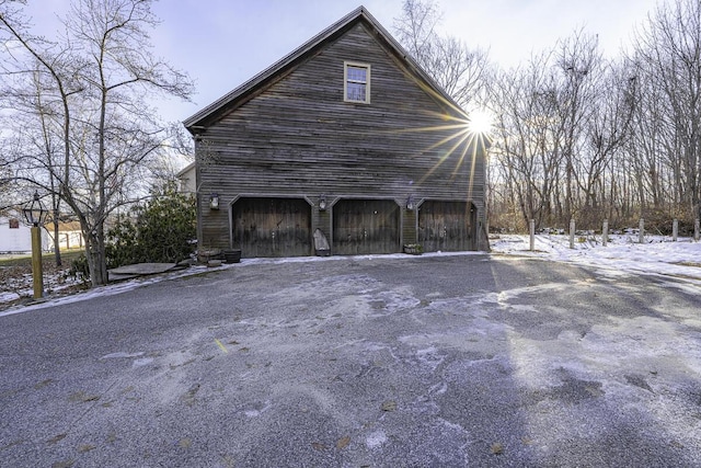 view of side of property featuring an outbuilding