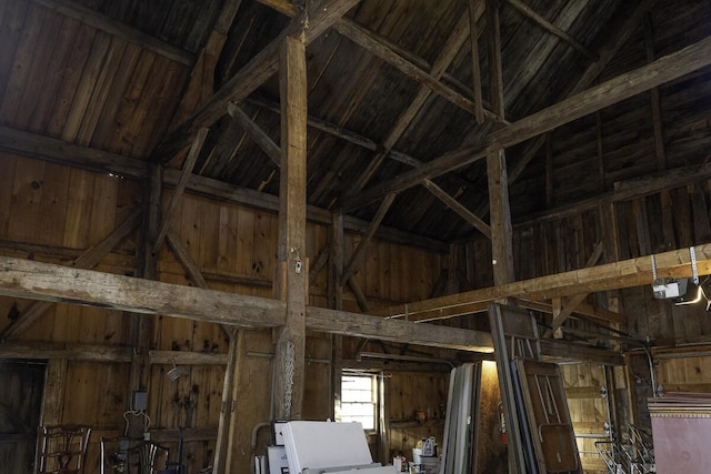 misc room with lofted ceiling with beams