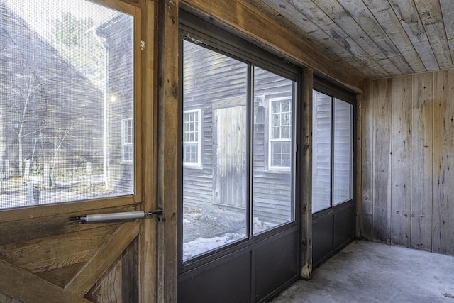 sunroom / solarium featuring wood ceiling