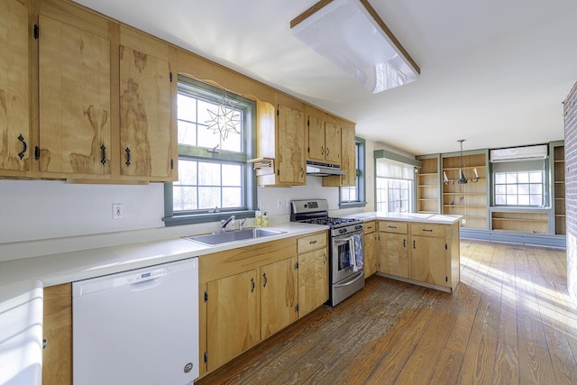 kitchen with decorative light fixtures, dark hardwood / wood-style floors, sink, stainless steel range with gas cooktop, and white dishwasher