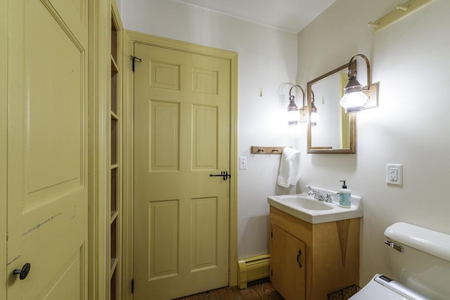 bathroom with toilet and vanity