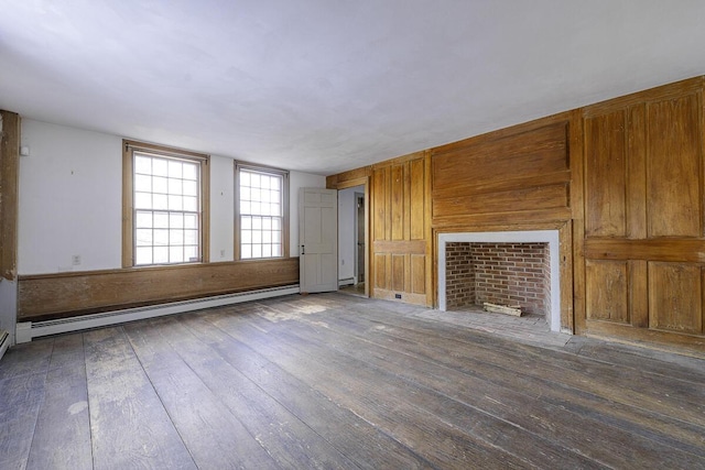 unfurnished living room featuring hardwood / wood-style flooring and a baseboard radiator