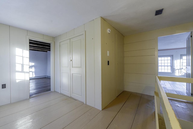 corridor featuring light hardwood / wood-style flooring