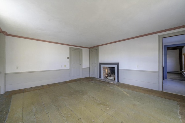 unfurnished living room with wood-type flooring and crown molding