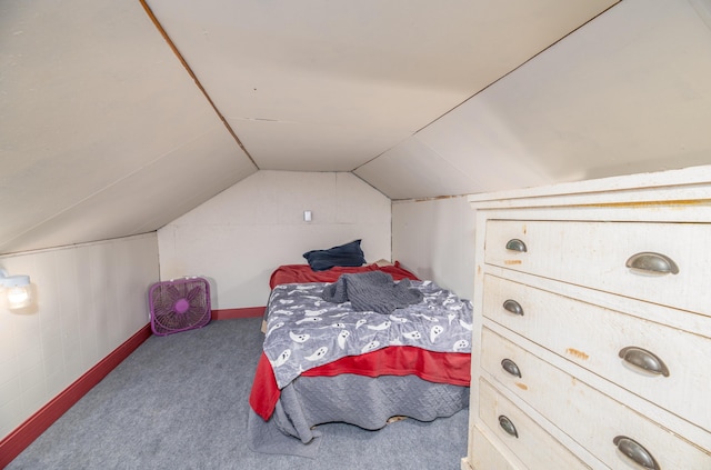 carpeted bedroom featuring vaulted ceiling