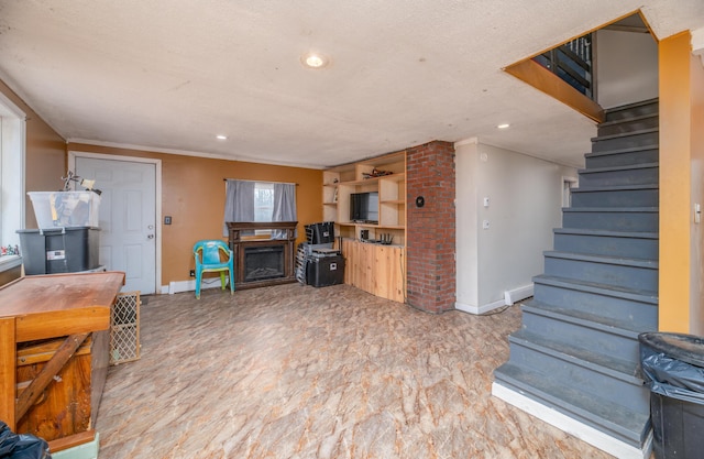 living room featuring a fireplace and a textured ceiling