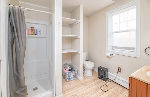 bathroom with a shower with curtain, vanity, toilet, and a baseboard heating unit