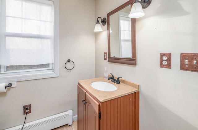 bathroom with vanity and a baseboard heating unit