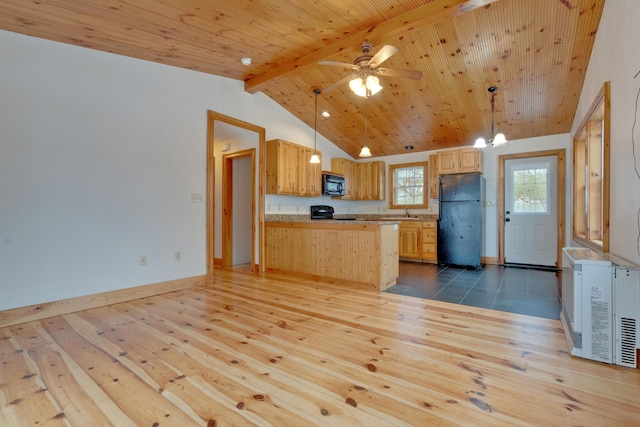 1696 N Rd, Parsonsfield, ME 04047 - kitchen featuring black appliances, vaulted ceiling with beams, hardwood / wood-style floors, and hanging light fixtures