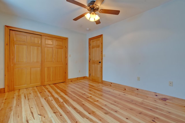 1696 N Rd, Parsonsfield, ME 04047 - unfurnished bedroom featuring light wood-type flooring, a closet, and ceiling fan