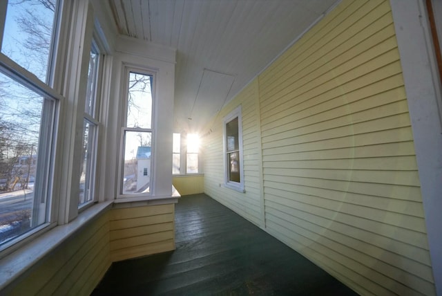 unfurnished sunroom featuring a wealth of natural light