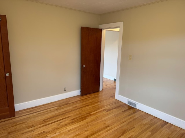 empty room with light wood-type flooring