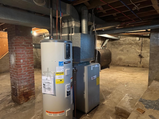 utility room featuring heating unit and water heater