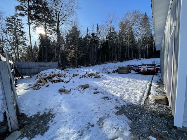 view of yard covered in snow