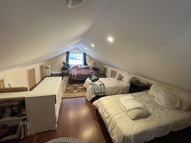 bedroom with dark hardwood / wood-style floors and vaulted ceiling