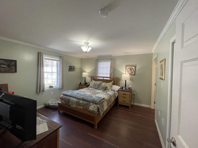 bedroom with crown molding and dark hardwood / wood-style floors