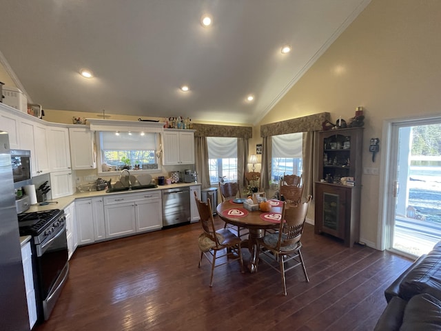 kitchen with white cabinets, plenty of natural light, sink, and appliances with stainless steel finishes