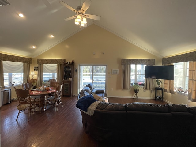 living room featuring dark hardwood / wood-style flooring, plenty of natural light, ornamental molding, and ceiling fan