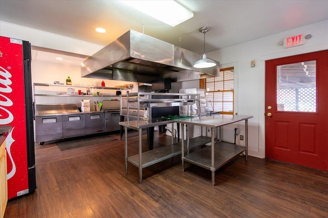 kitchen with pendant lighting, dark wood-type flooring, refrigerator, and exhaust hood