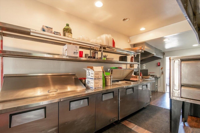 kitchen featuring dark hardwood / wood-style flooring and wood counters