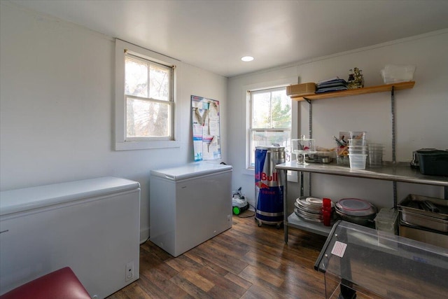 clothes washing area featuring separate washer and dryer and dark wood-type flooring