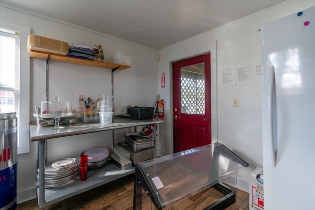 kitchen featuring white refrigerator and dark hardwood / wood-style flooring