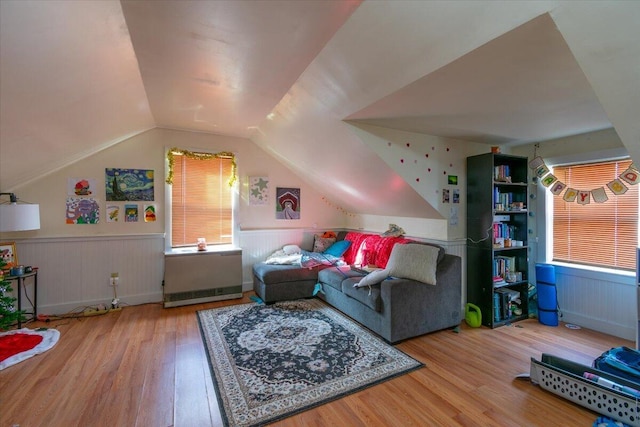 living room featuring hardwood / wood-style floors and lofted ceiling