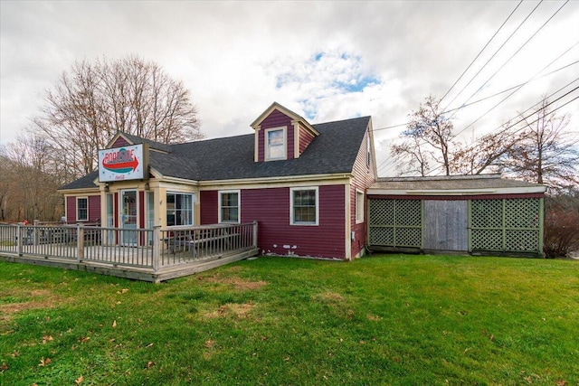 rear view of property with a yard