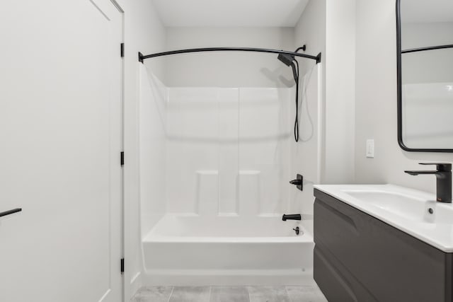 bathroom with vanity and  shower combination