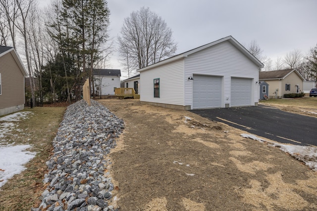 view of side of property featuring a garage