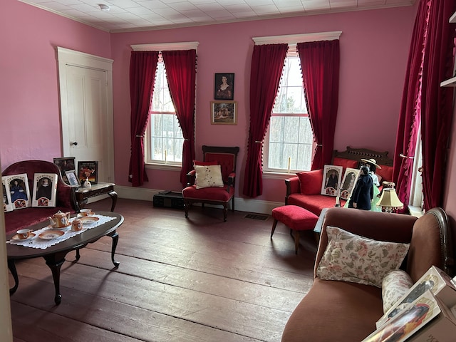 sitting room with hardwood / wood-style flooring