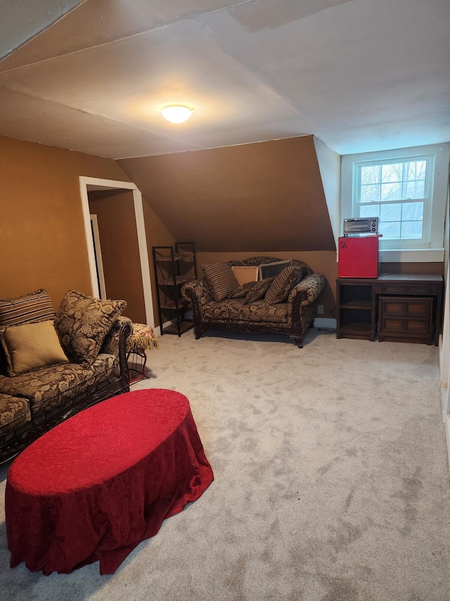 interior space with carpet flooring and lofted ceiling