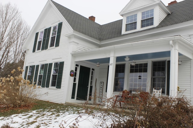 view of snow covered property entrance